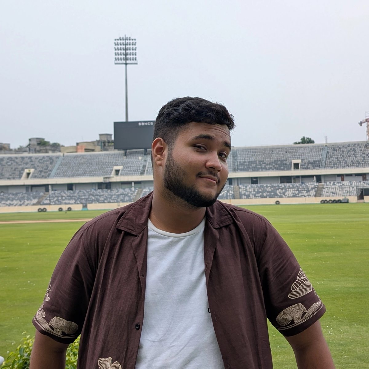 Portrait of S M Saem at a cricket stadium